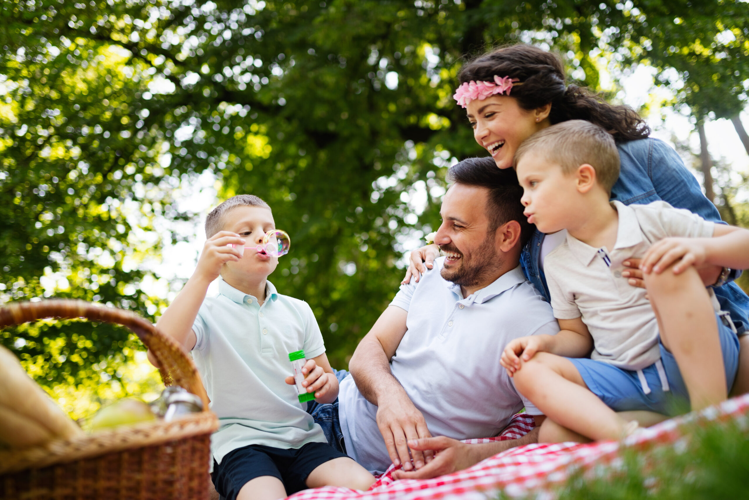 Happy family with children enjoying a summer day together outdoor